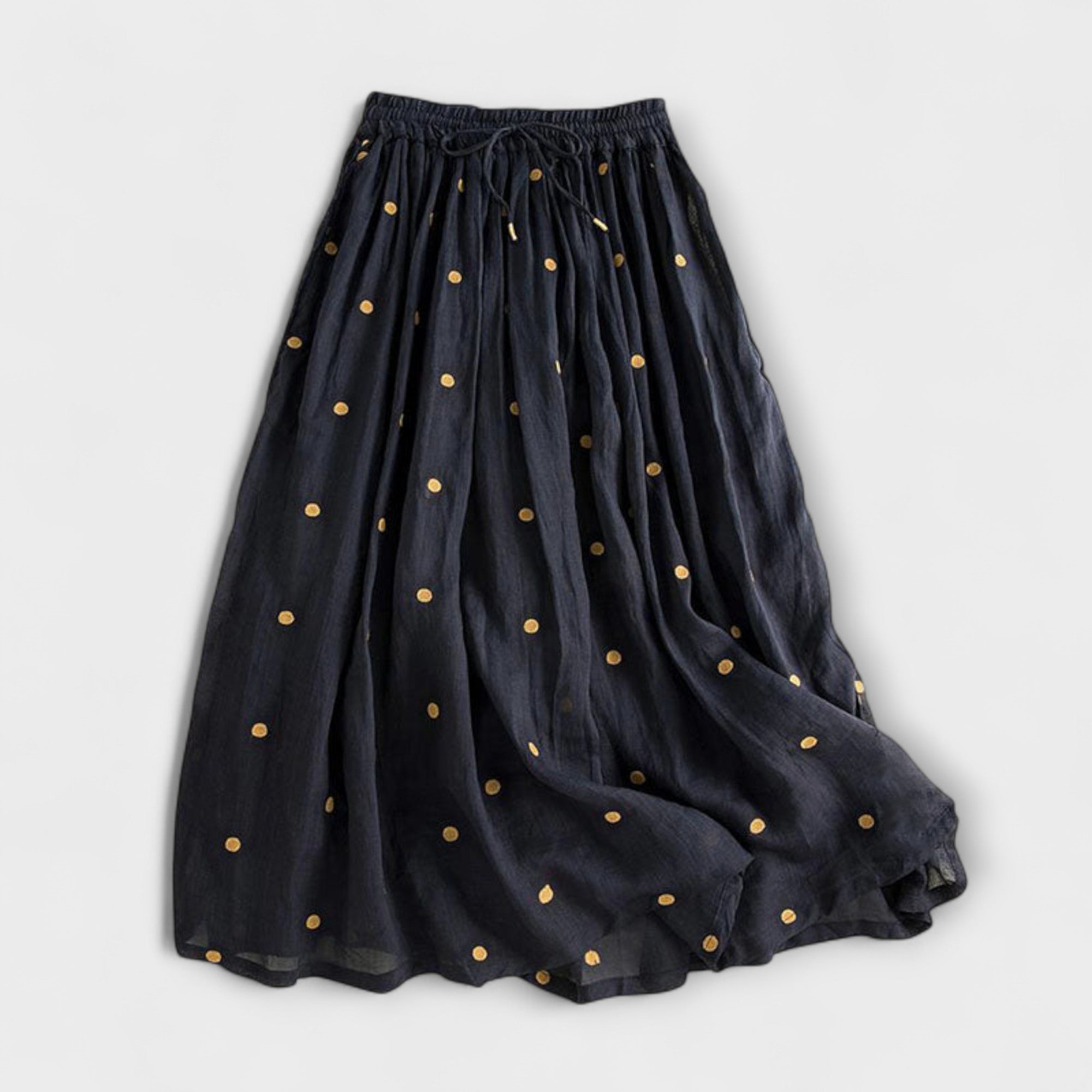 Playful polka-dot skirt made of cotton-linen.
